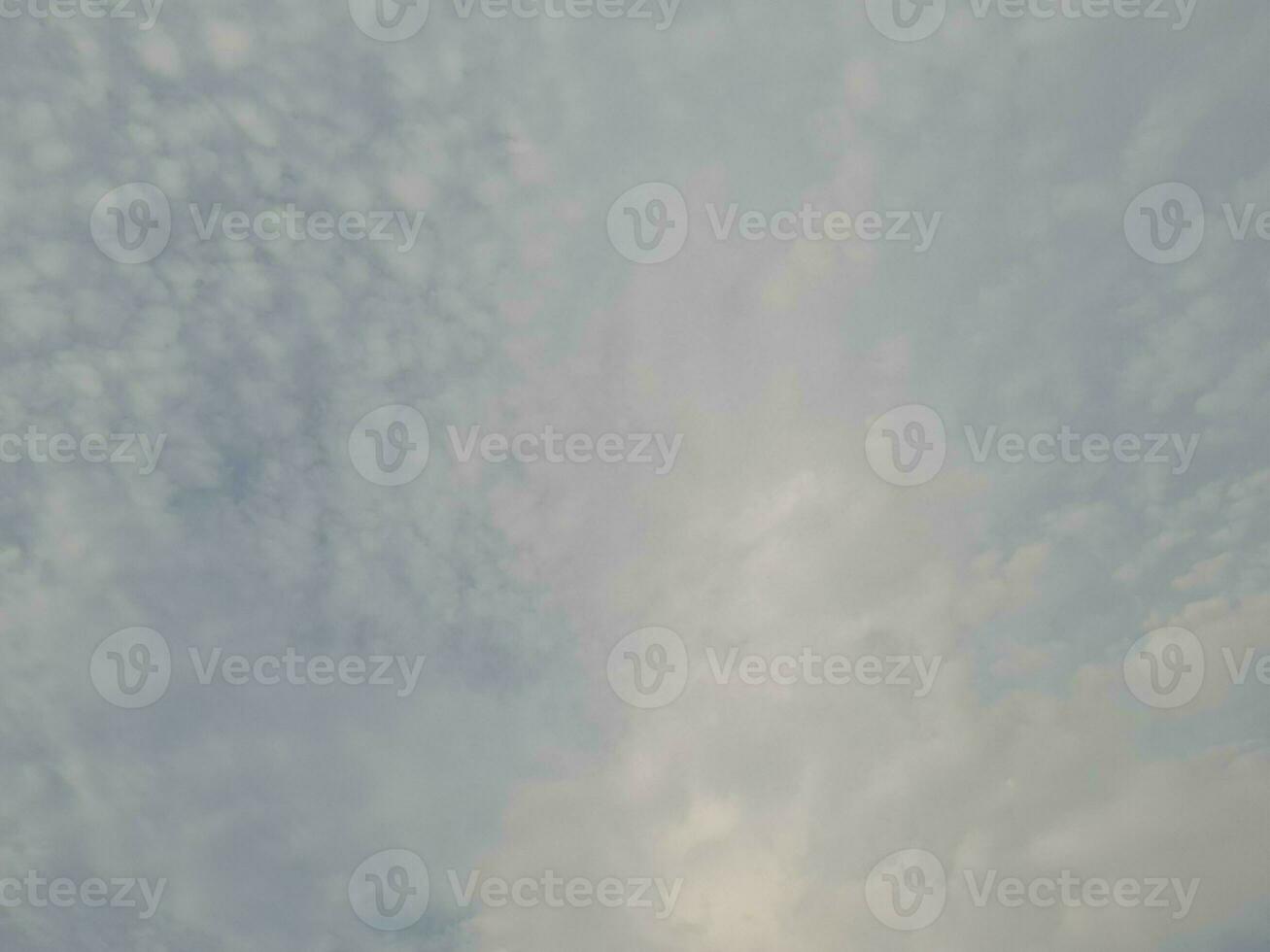 Nature background. Sky, sun and clouds with rays of light at sunset on the island of Lombok, Indonesia. photo