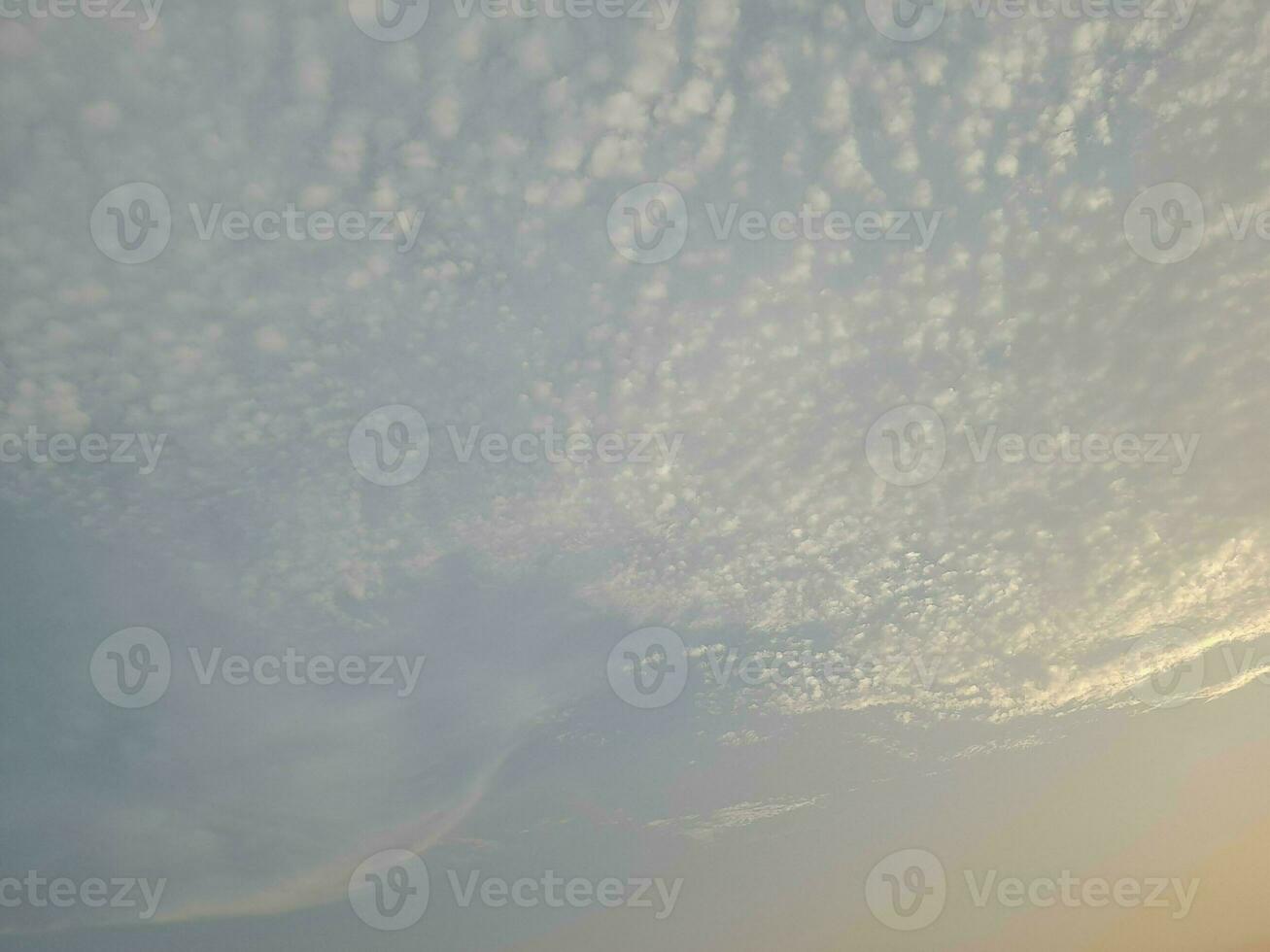 Nature background. Sky, sun and clouds with rays of light at sunset on the island of Lombok, Indonesia. photo