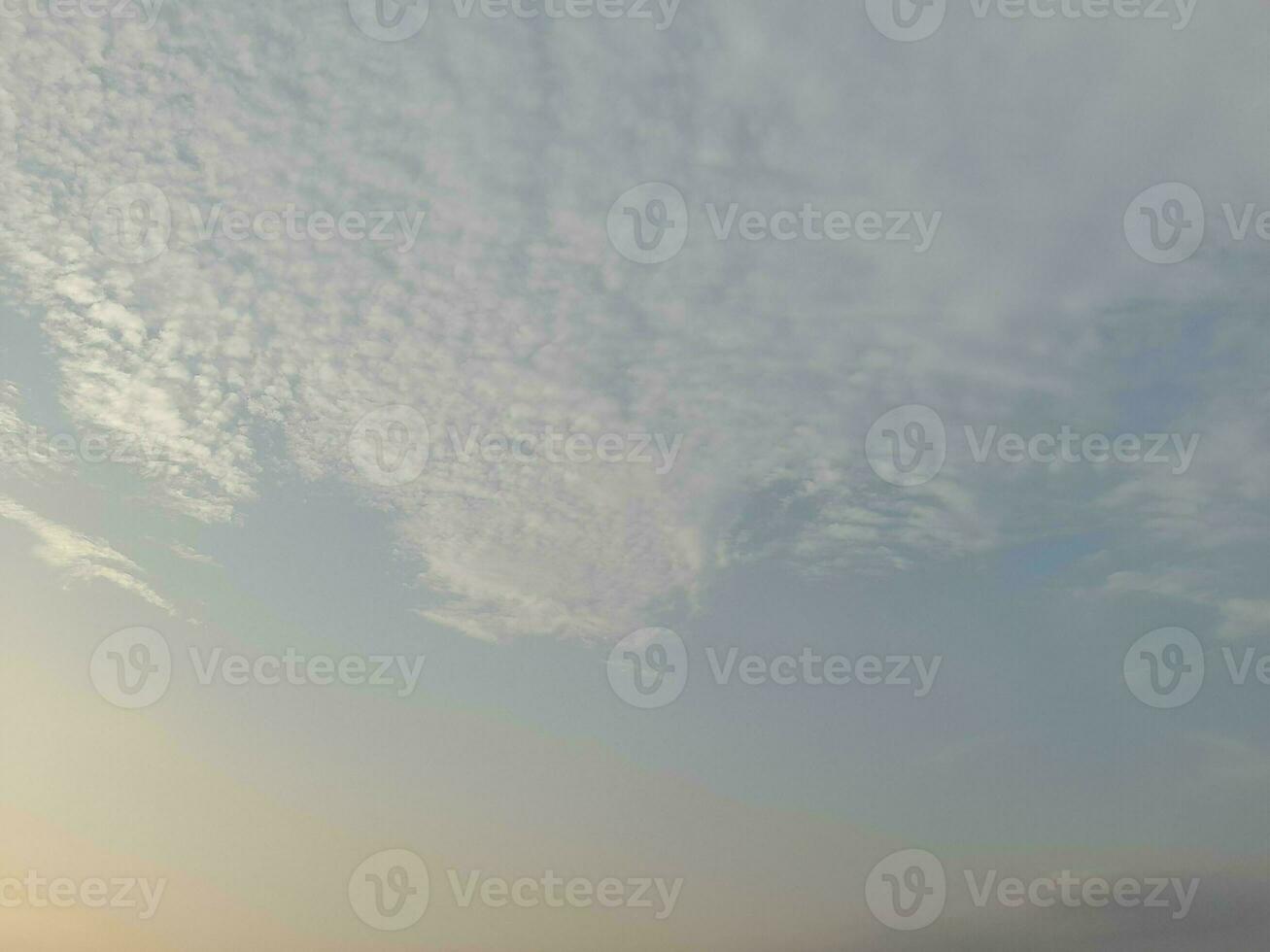 Nature background. Sky, sun and clouds with rays of light at sunset on the island of Lombok, Indonesia. photo