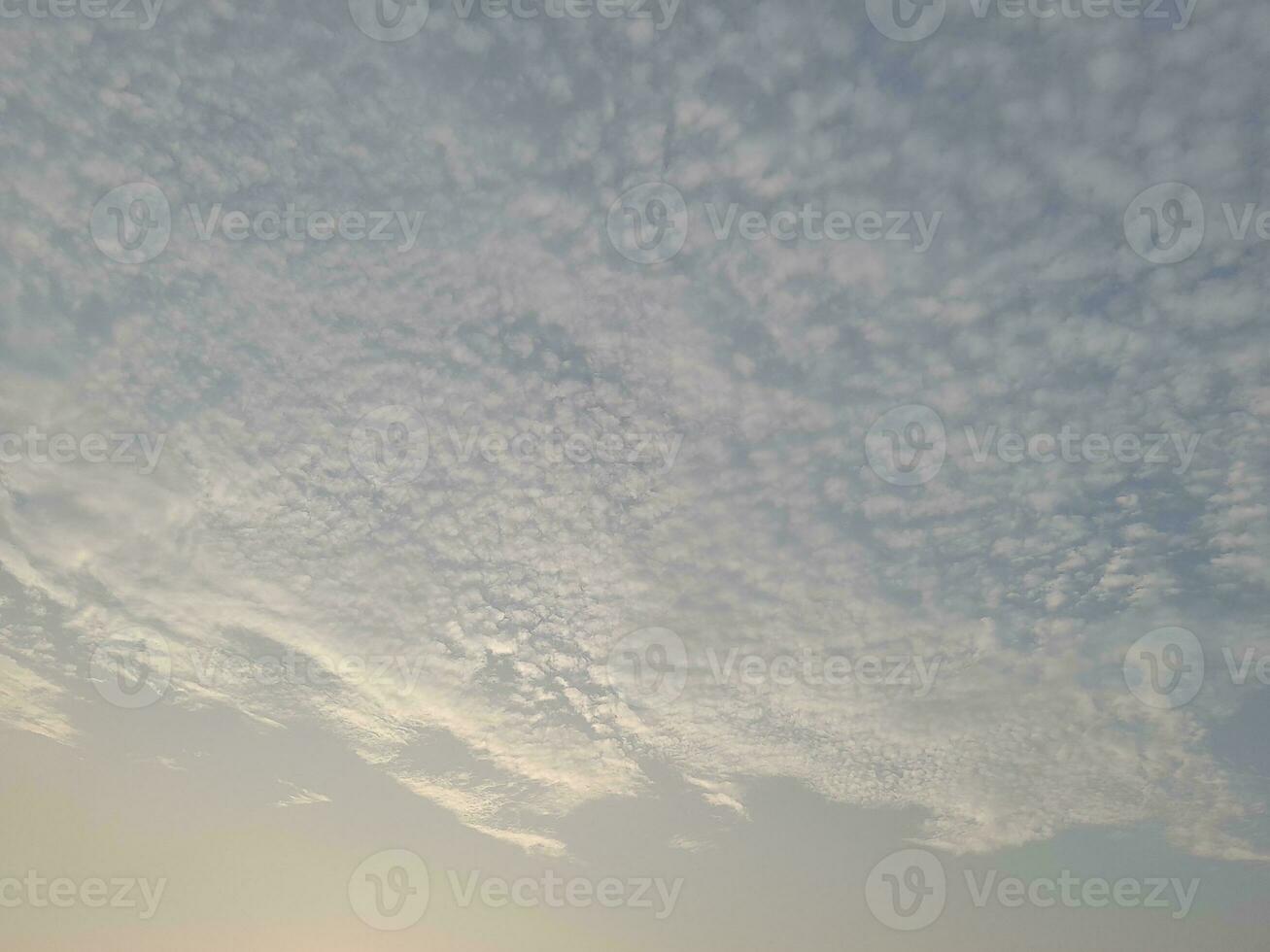 Nature background. Sky, sun and clouds with rays of light at sunset on the island of Lombok, Indonesia. photo