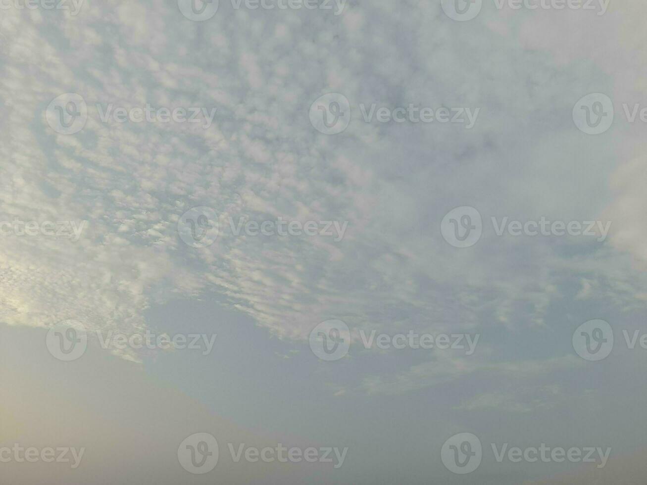 Nature background. Sky, sun and clouds with rays of light at sunset on the island of Lombok, Indonesia. photo