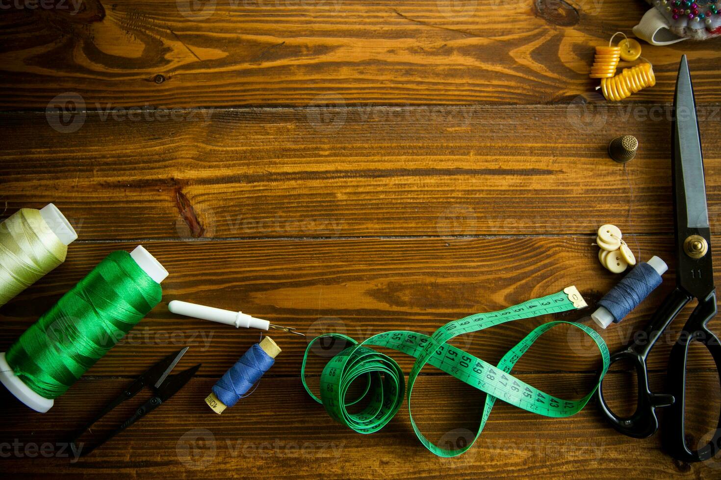 a set of tools and threads for sewing clothes photo