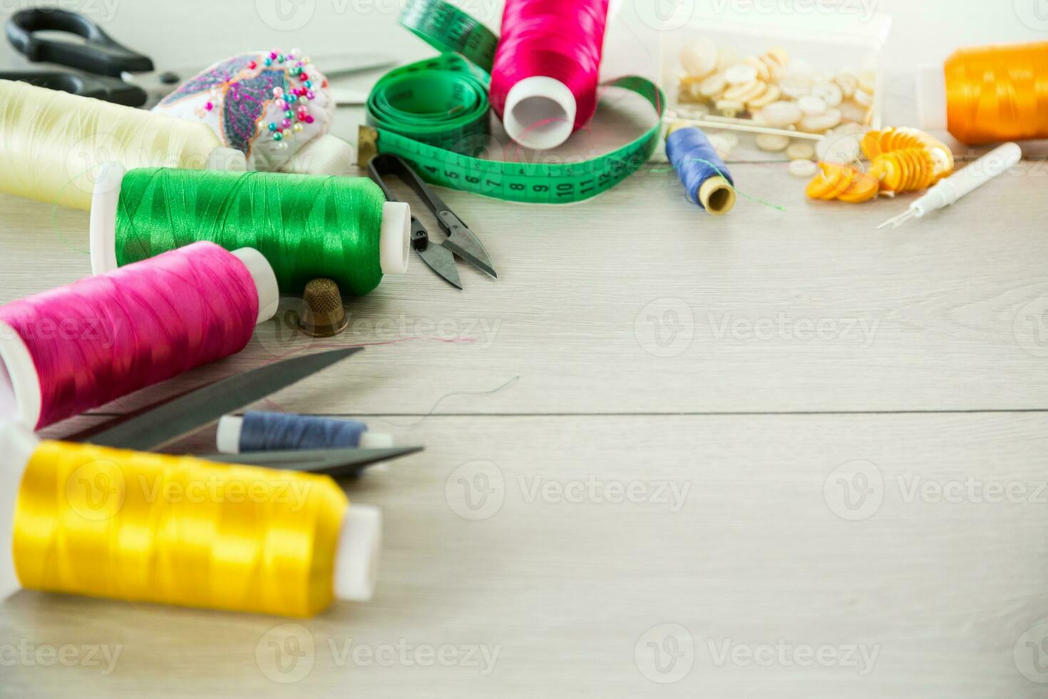 a set of tools and threads for sewing clothes photo