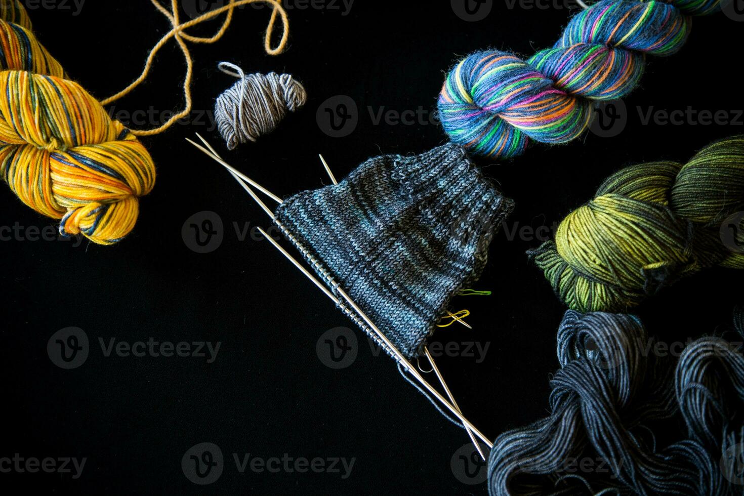 Colored threads, knitting needles and other items for hand knitting photo