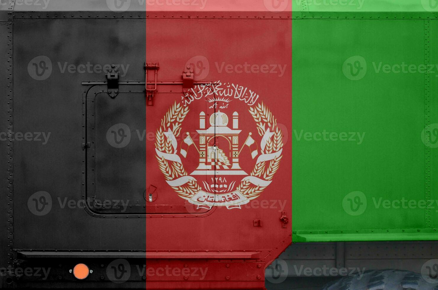 Afghanistan flag depicted on side part of military armored truck closeup. Army forces conceptual background photo