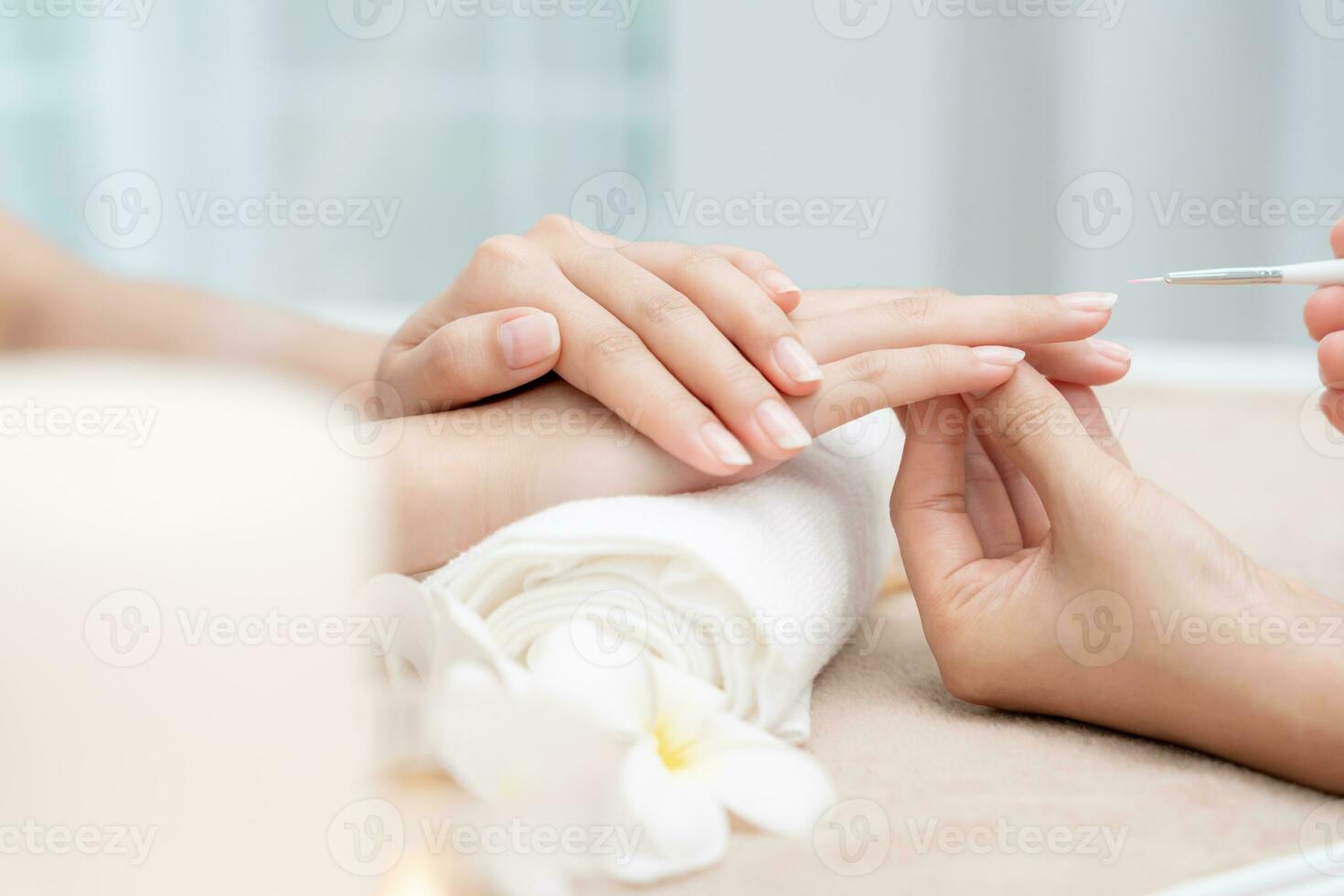 Woman receive care service by professional Beautician Manicure at spa centre. Nail beauty salon use nail file for Glazing treatment. manicurist make nail customer to beautiful. body care spa treatment photo