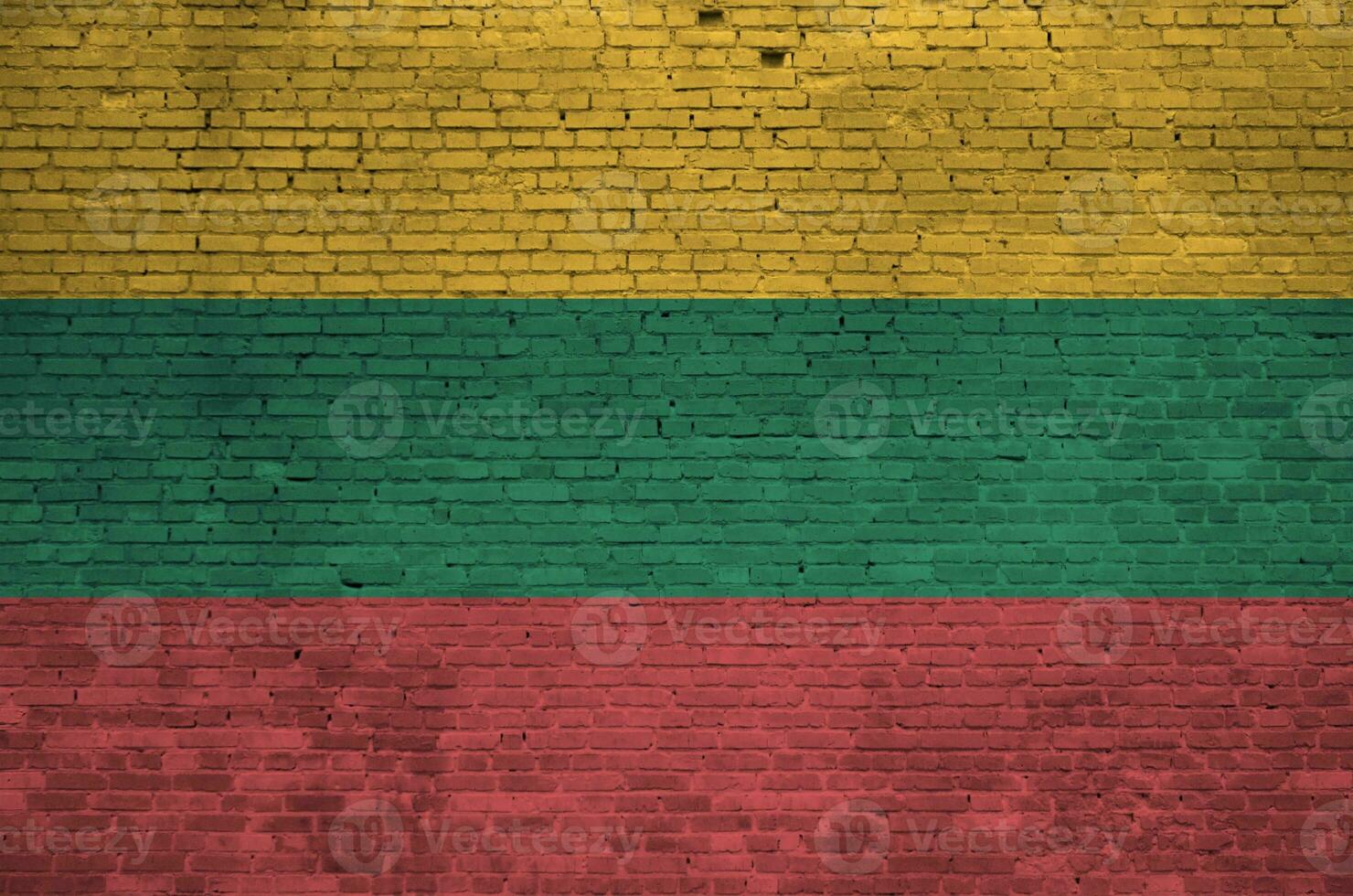 Lithuania flag depicted in paint colors on old brick wall. Textured banner on big brick wall masonry background photo