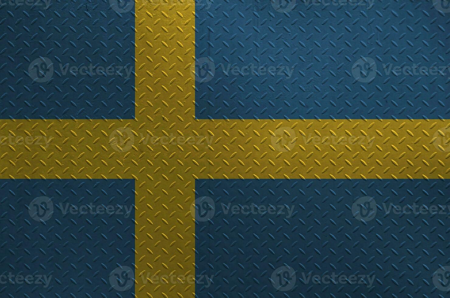 Sweden flag depicted in paint colors on old brushed metal plate or wall closeup. Textured banner on rough background photo