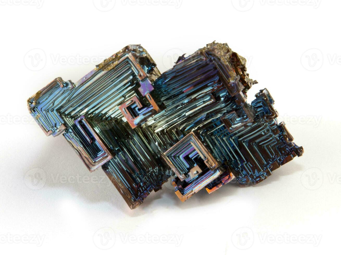 Rainbow colorful mineral bismuth closeup macro on a dark background photo