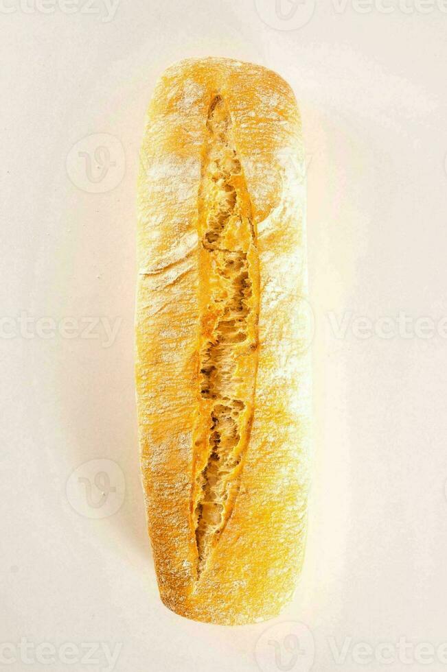 a loaf of bread on a white surface photo
