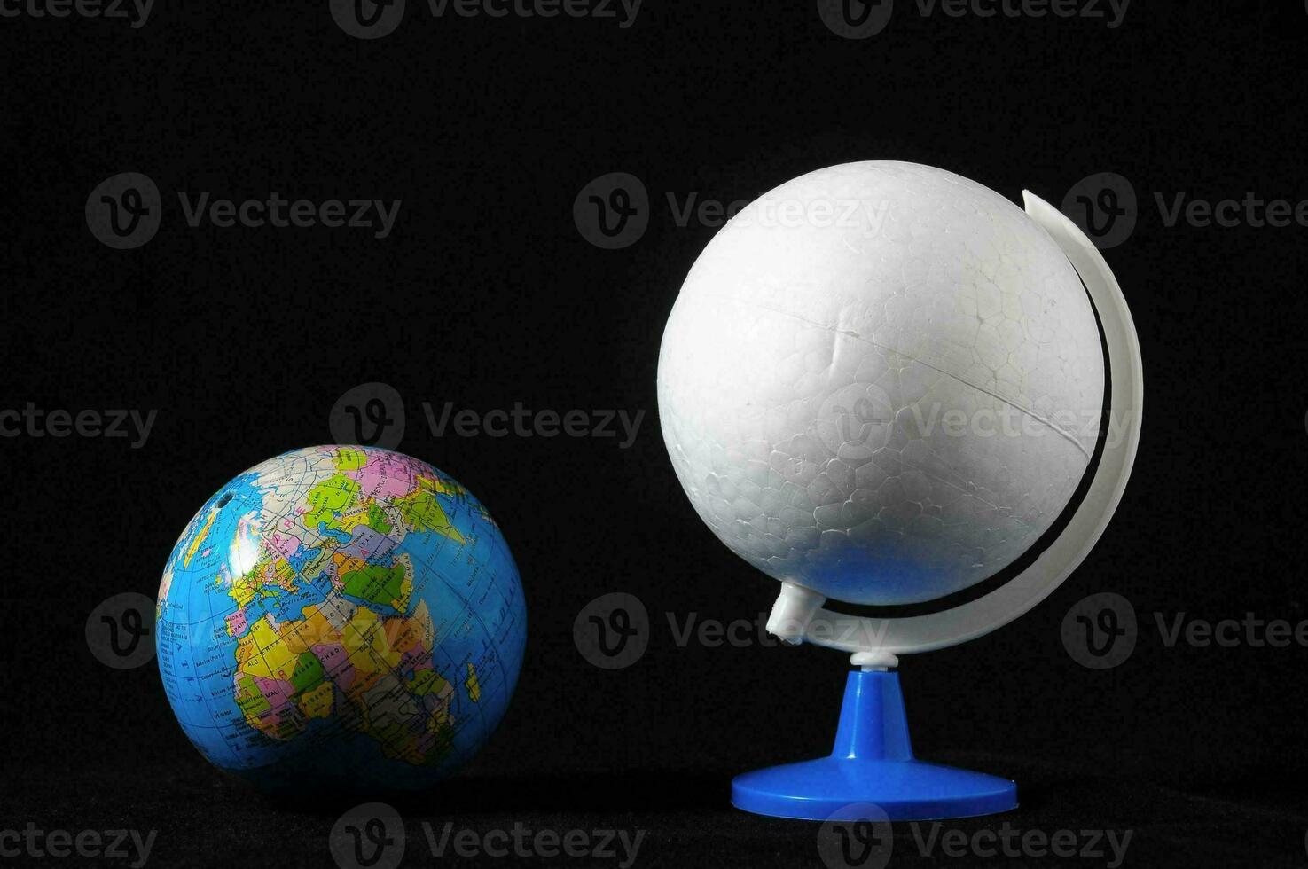 Earth globes on black background photo