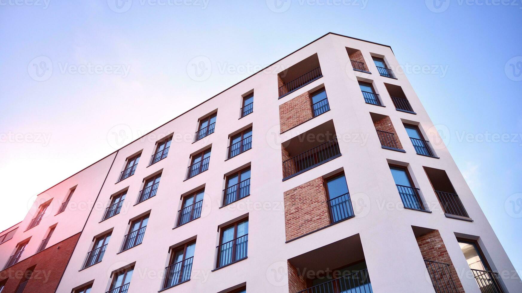 Condominium and apartment building with  symmetrical modern architecture in the city downtown. photo
