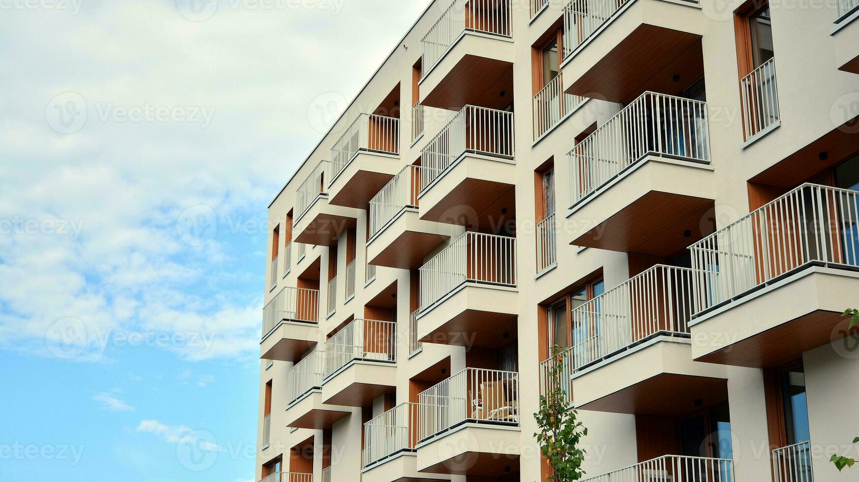 Condominium and apartment building with  symmetrical modern architecture in the city downtown. photo