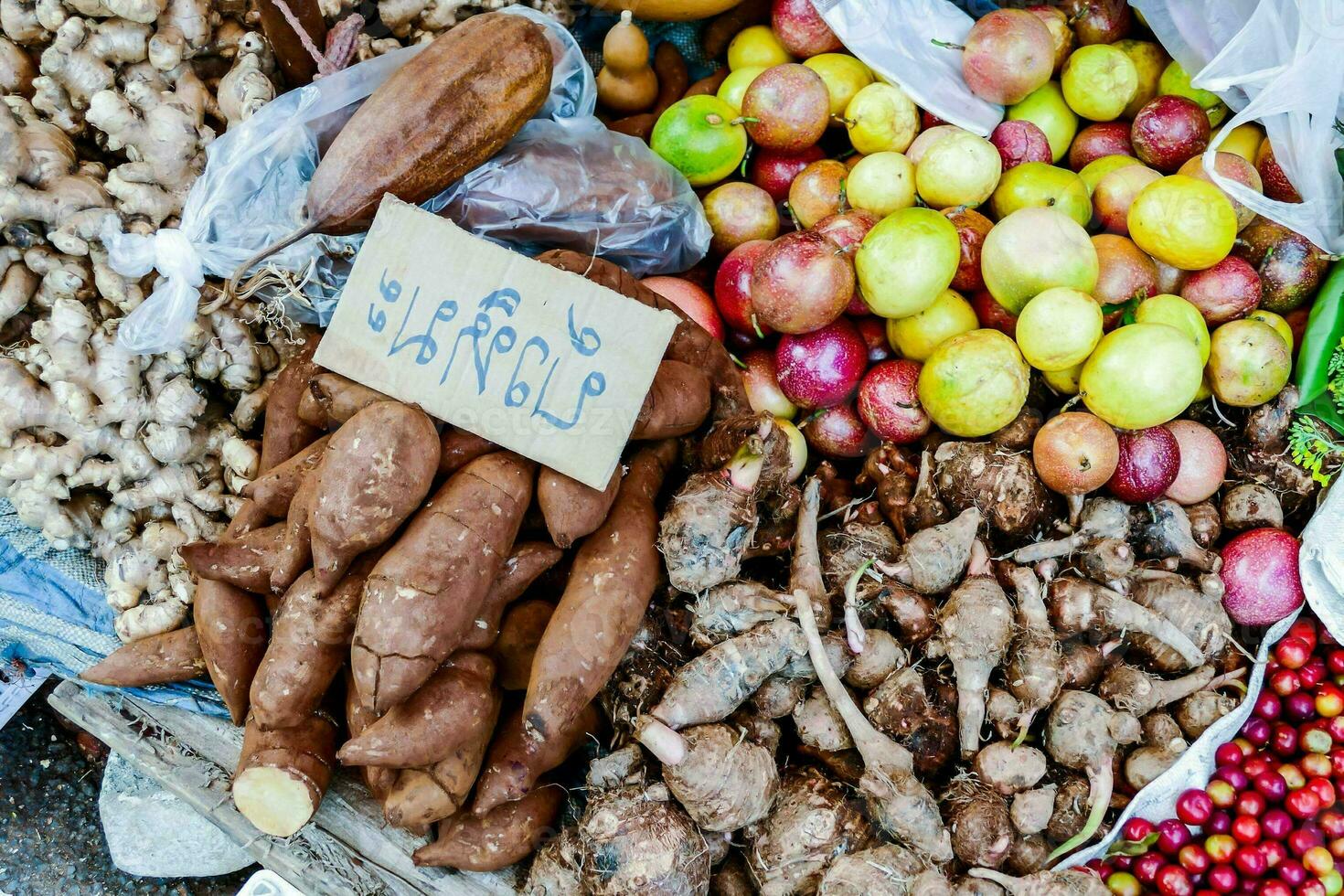 A stand with different fruits and vegetables photo