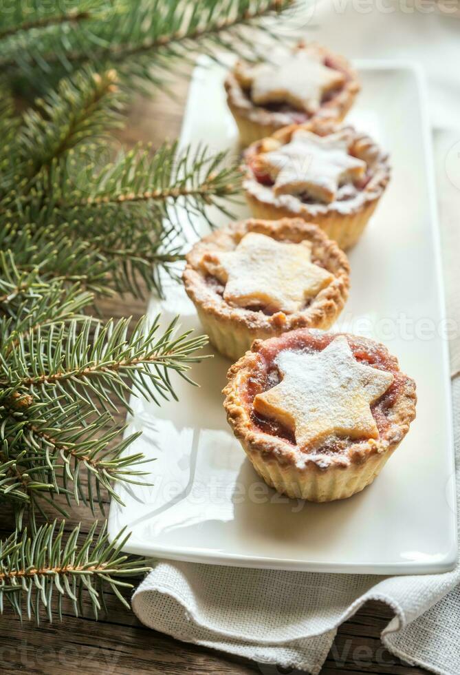 Mince pies with Christmas tree branch photo