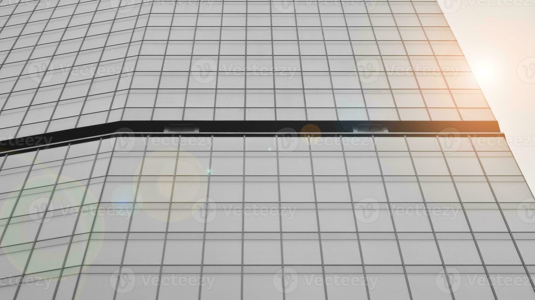 Glass modern building with blue sky background. View and architecture details. Urban abstract - windows of glass office building in  sunlight day. Black and white. photo