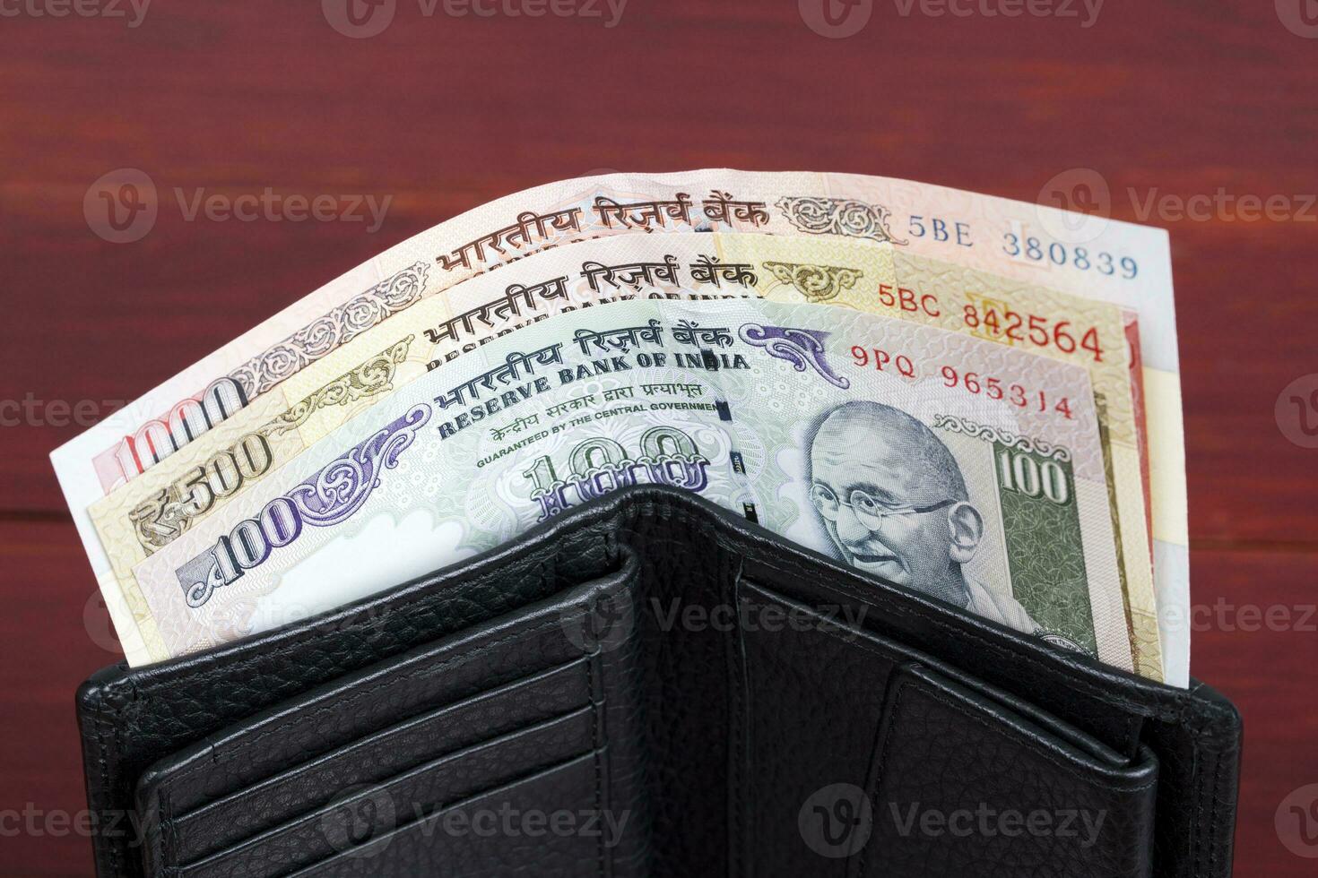 Old Indian money  in the black wallet photo