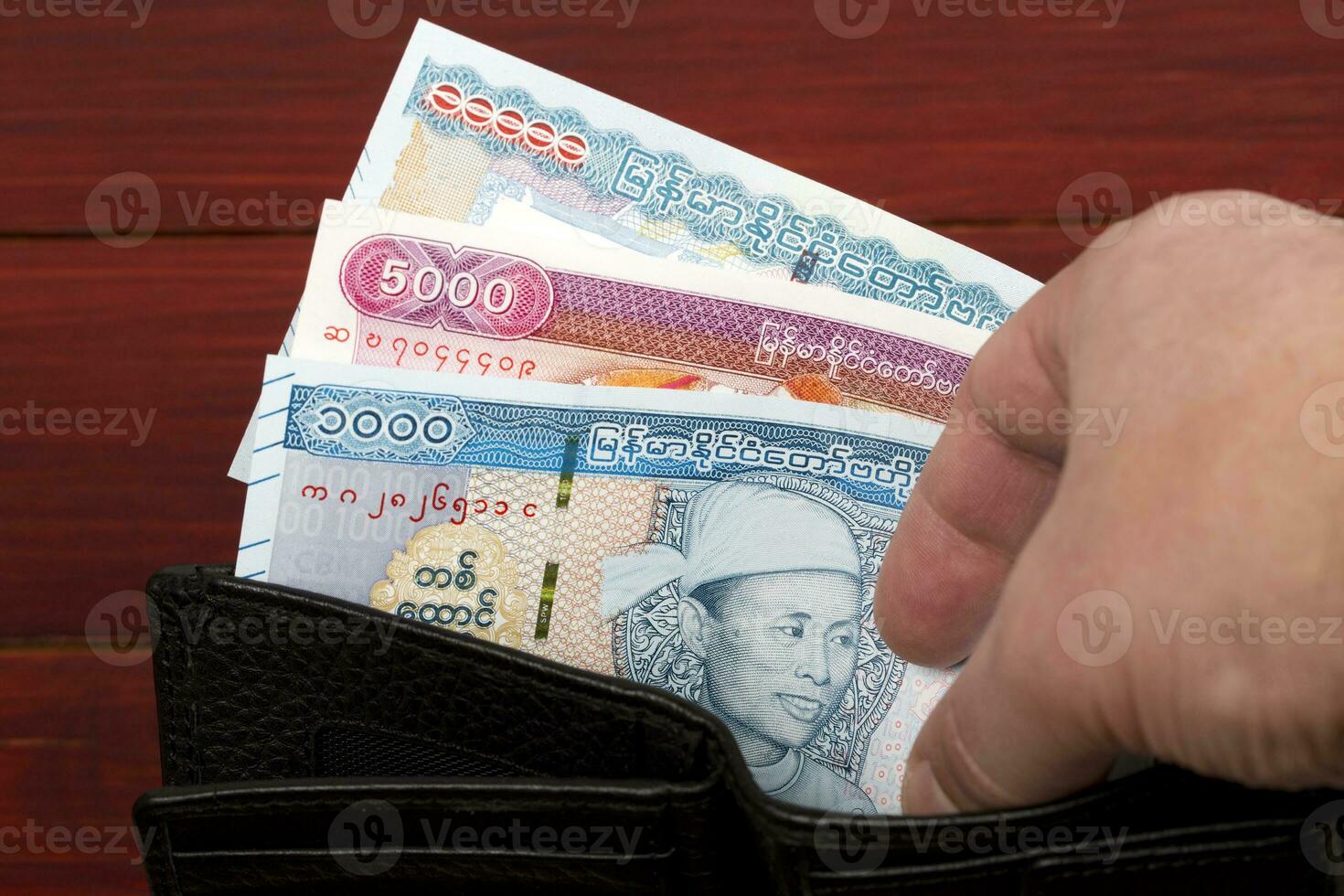 Myanmar money in the black wallet photo