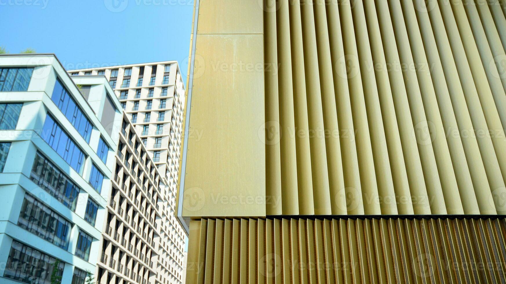 Combination of metal and glass wall material. Steel facade on columns. Abstract modern architecture. High-tech minimalist office building. Contemporary business architecture abstract fragment. photo