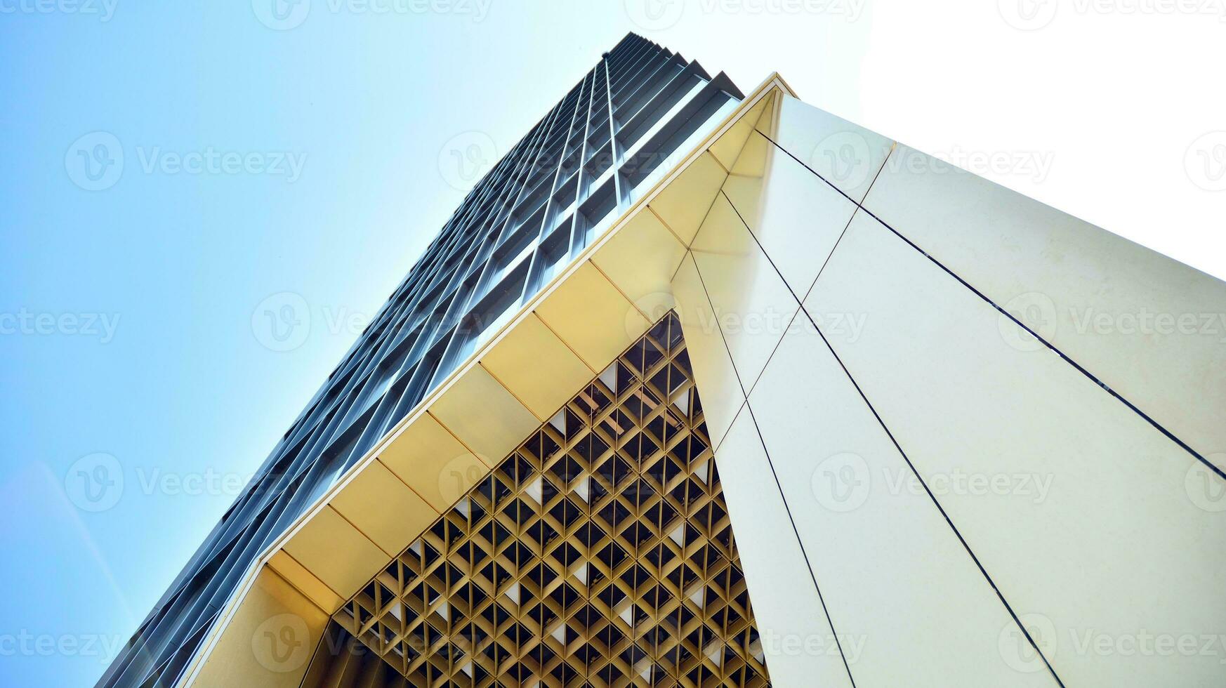 Combination of metal and glass wall material. Steel facade on columns. Abstract modern architecture. High-tech minimalist office building. Contemporary business architecture abstract fragment. photo