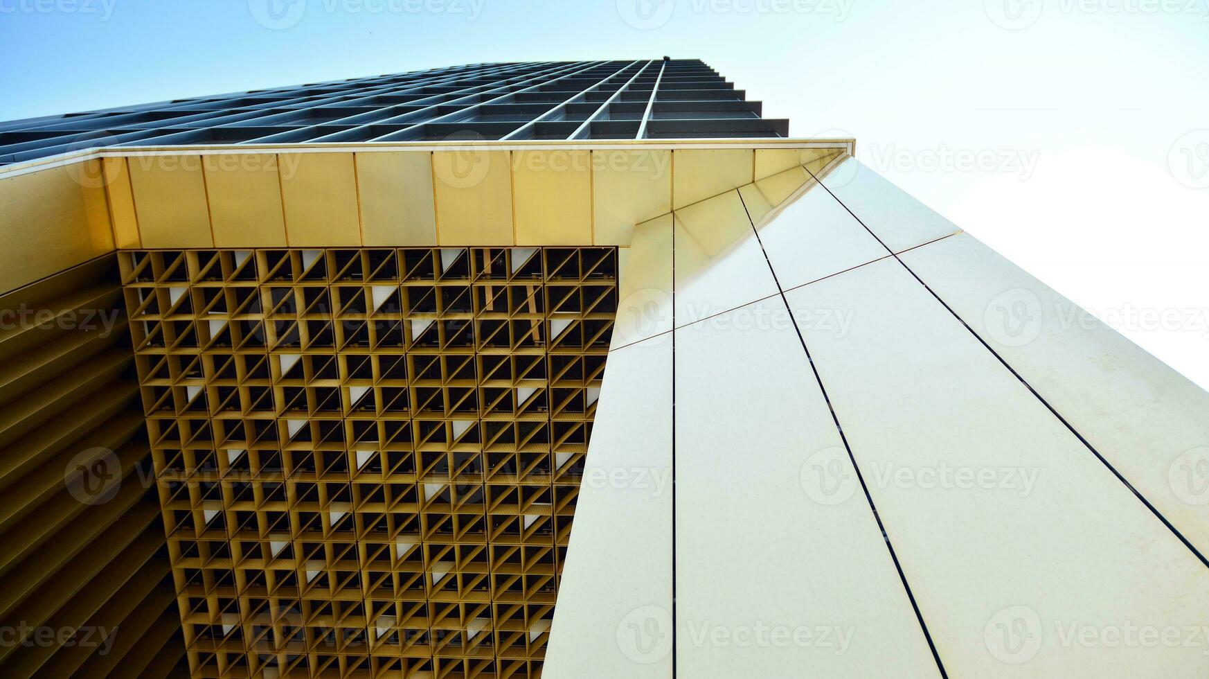 Combination of metal and glass wall material. Steel facade on columns. Abstract modern architecture. High-tech minimalist office building. Contemporary business architecture abstract fragment. photo