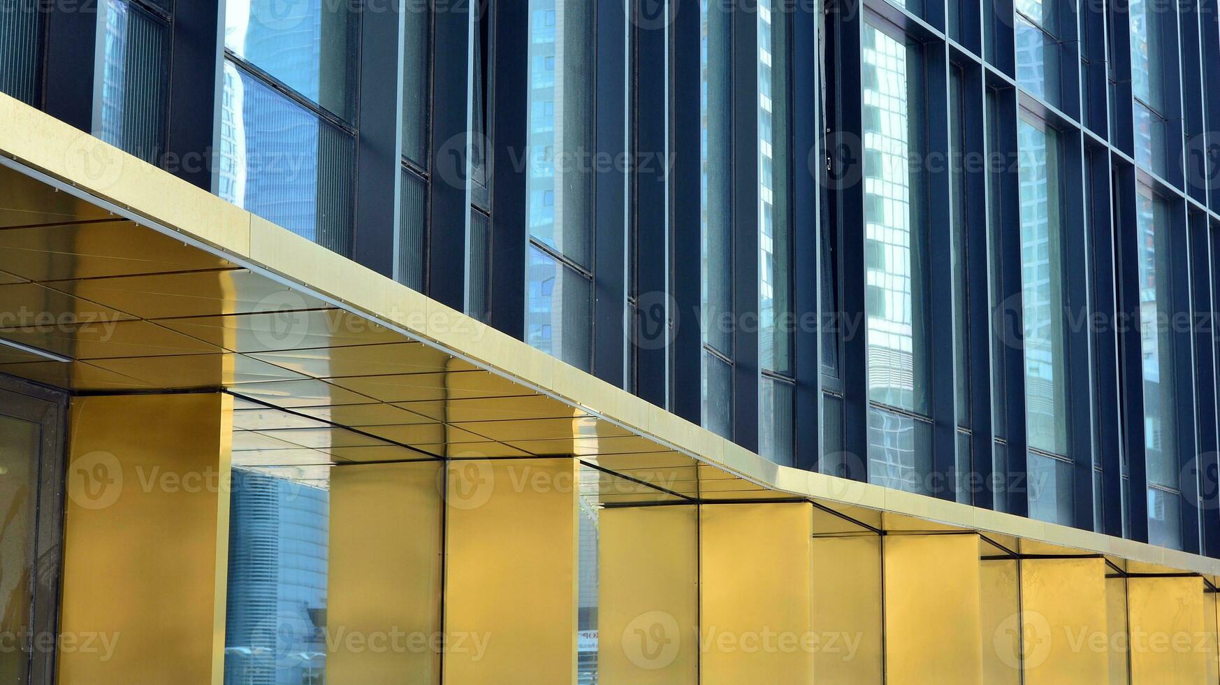 Combination of metal and glass wall material. Steel facade on columns. Abstract modern architecture. High-tech minimalist office building. Contemporary business architecture abstract fragment. photo