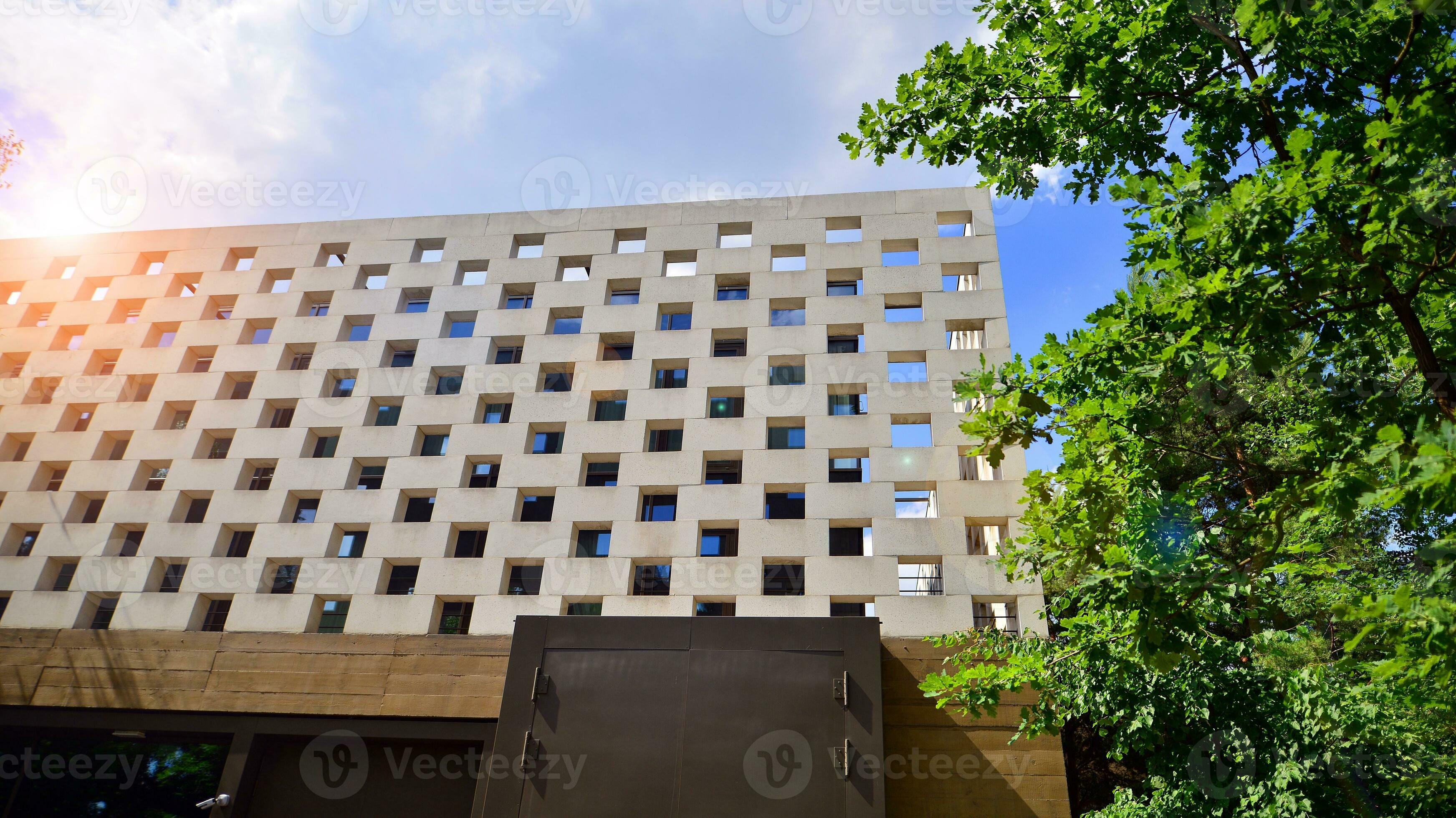 Minimalist photo of an exterior of a modern tin building with big glass