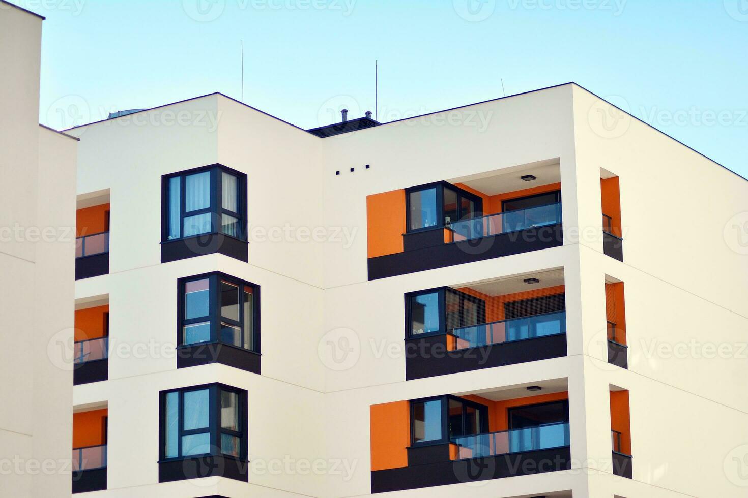 Cityscape with facade of a modern residential building. Modern European residential apartment building. photo