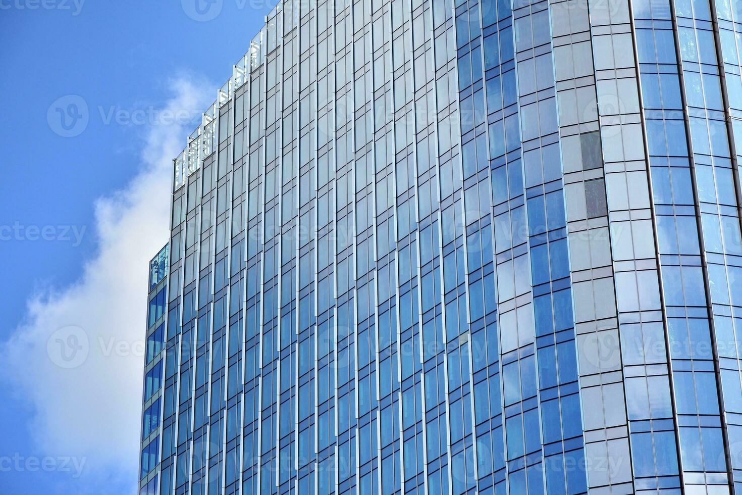 Fragment of glass and metal facade walls. Commercial office buildings. Abstract modern business architecture. photo