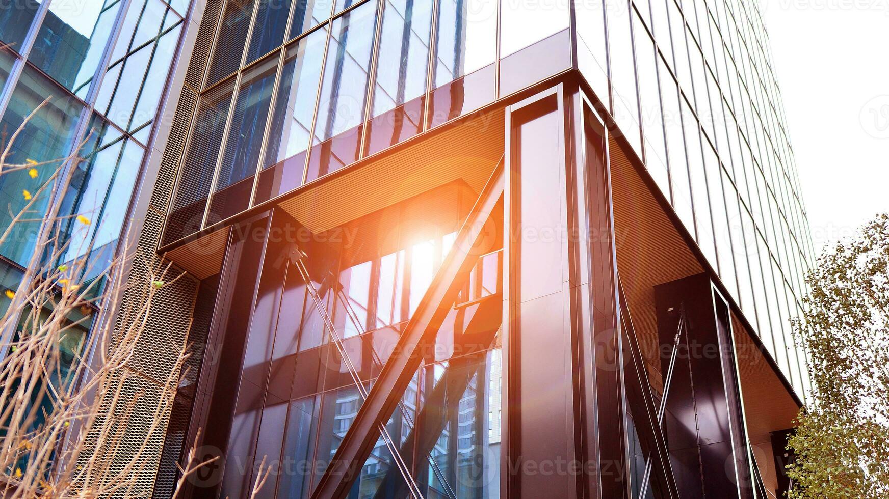 Combination of metal and glass wall material. Steel facade on columns. Abstract modern architecture. High-tech minimalist office building. Contemporary business architecture abstract fragment. photo