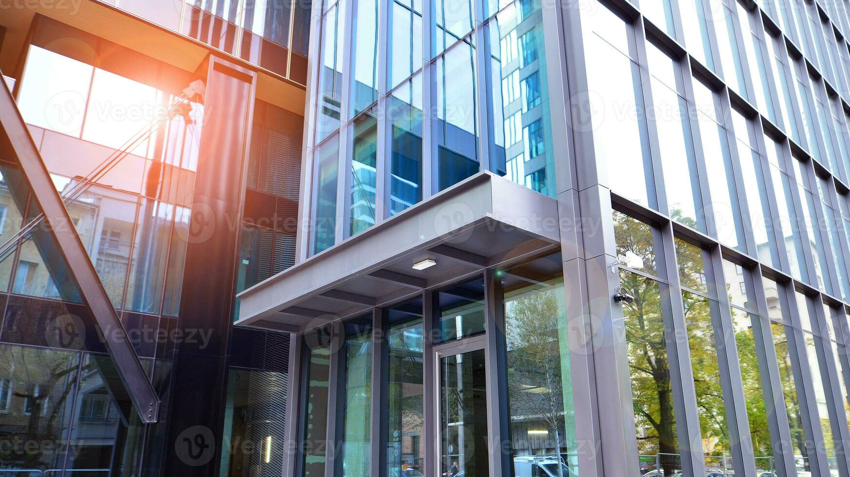 Combination of metal and glass wall material. Steel facade on columns. Abstract modern architecture. High-tech minimalist office building. Contemporary business architecture abstract fragment. photo