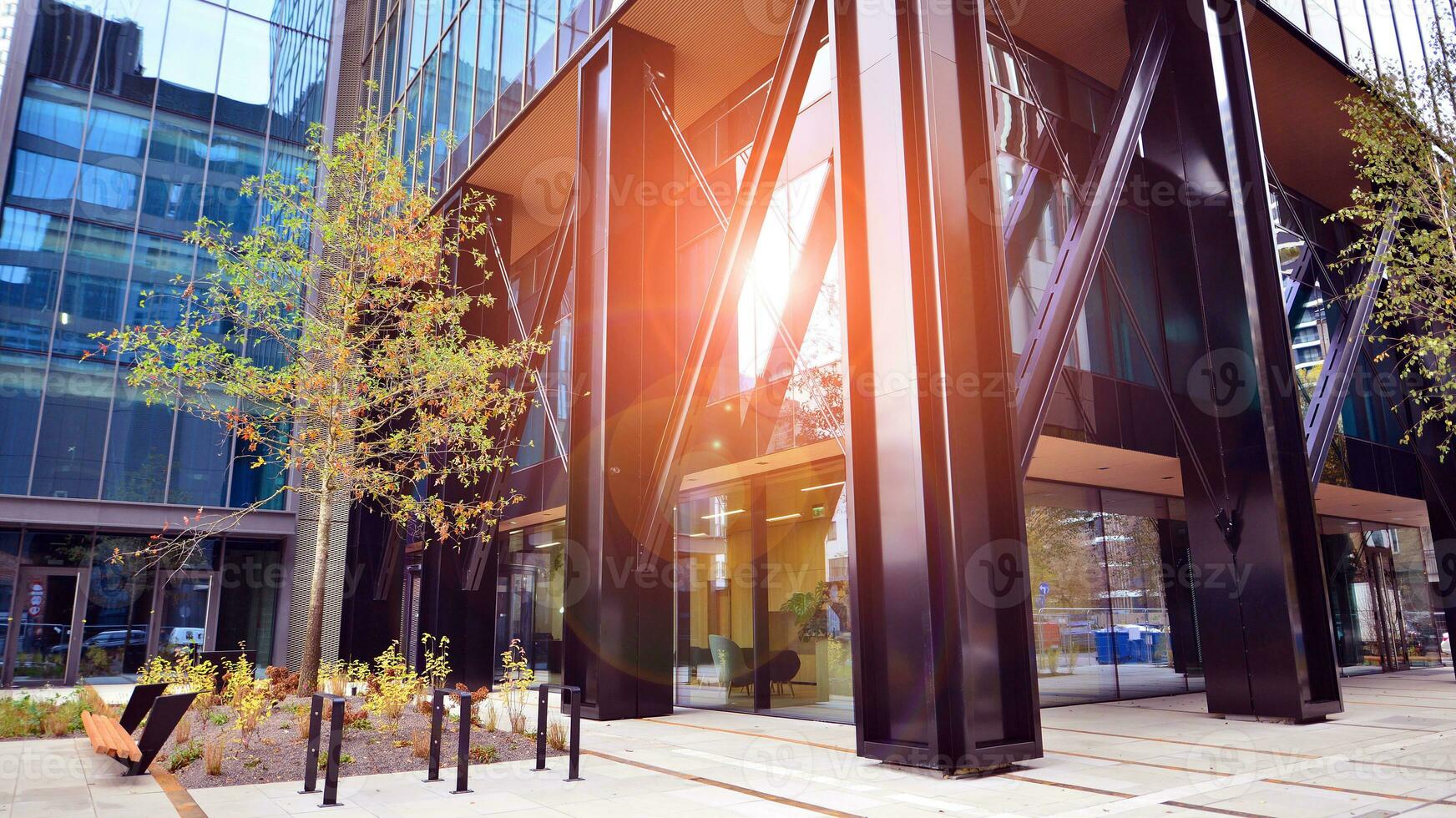 Combination of metal and glass wall material. Steel facade on columns. Abstract modern architecture. High-tech minimalist office building. Contemporary business architecture abstract fragment. photo