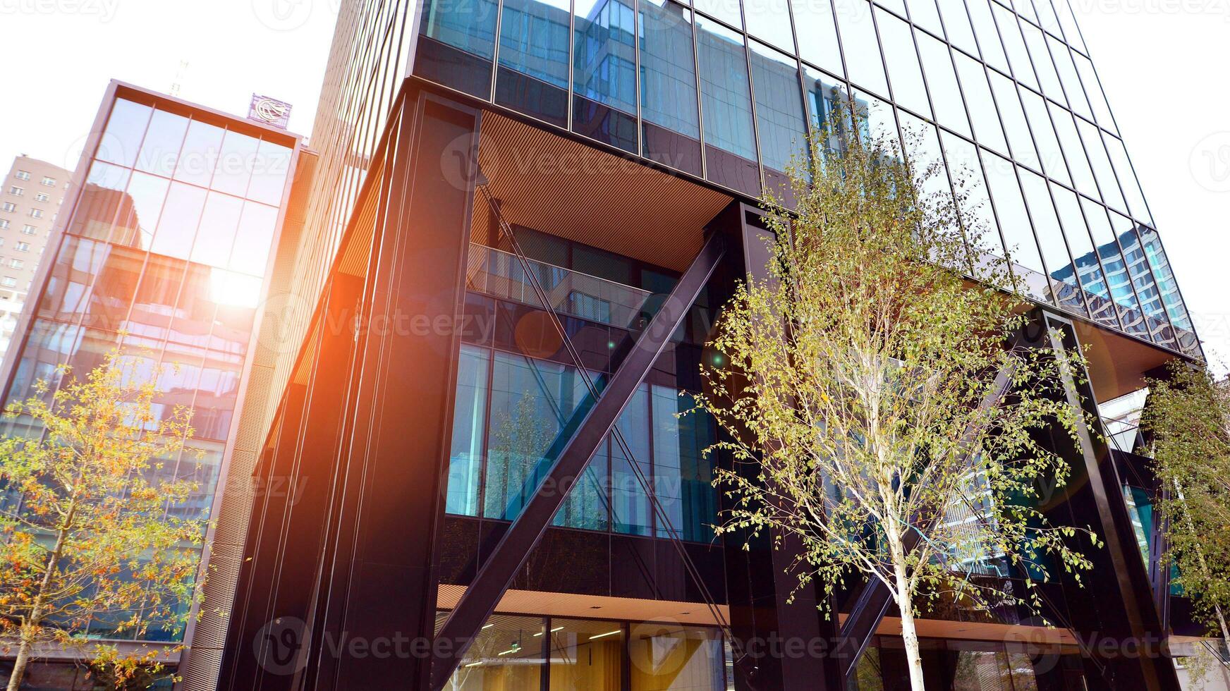 Combination of metal and glass wall material. Steel facade on columns. Abstract modern architecture. High-tech minimalist office building. Contemporary business architecture abstract fragment. photo