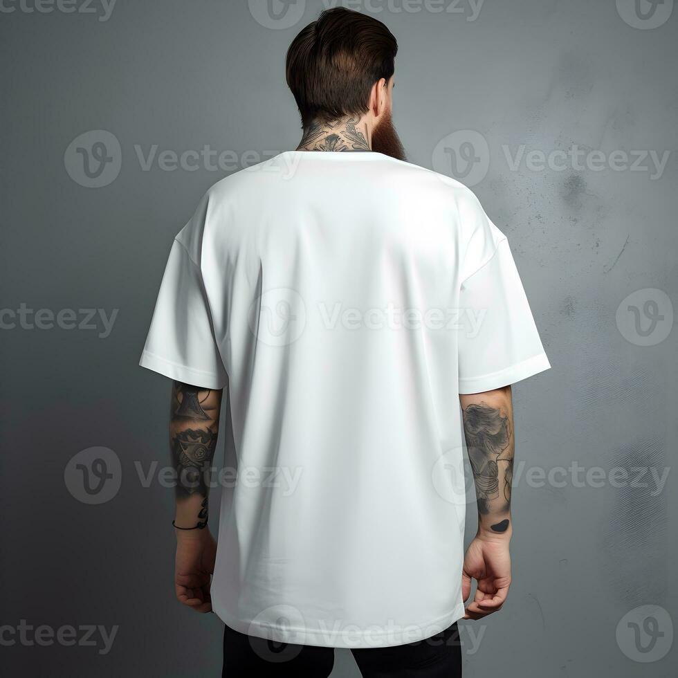 Back view of a man in blank white t-shirt in front of grey wall for design mockup. Generative AI photo