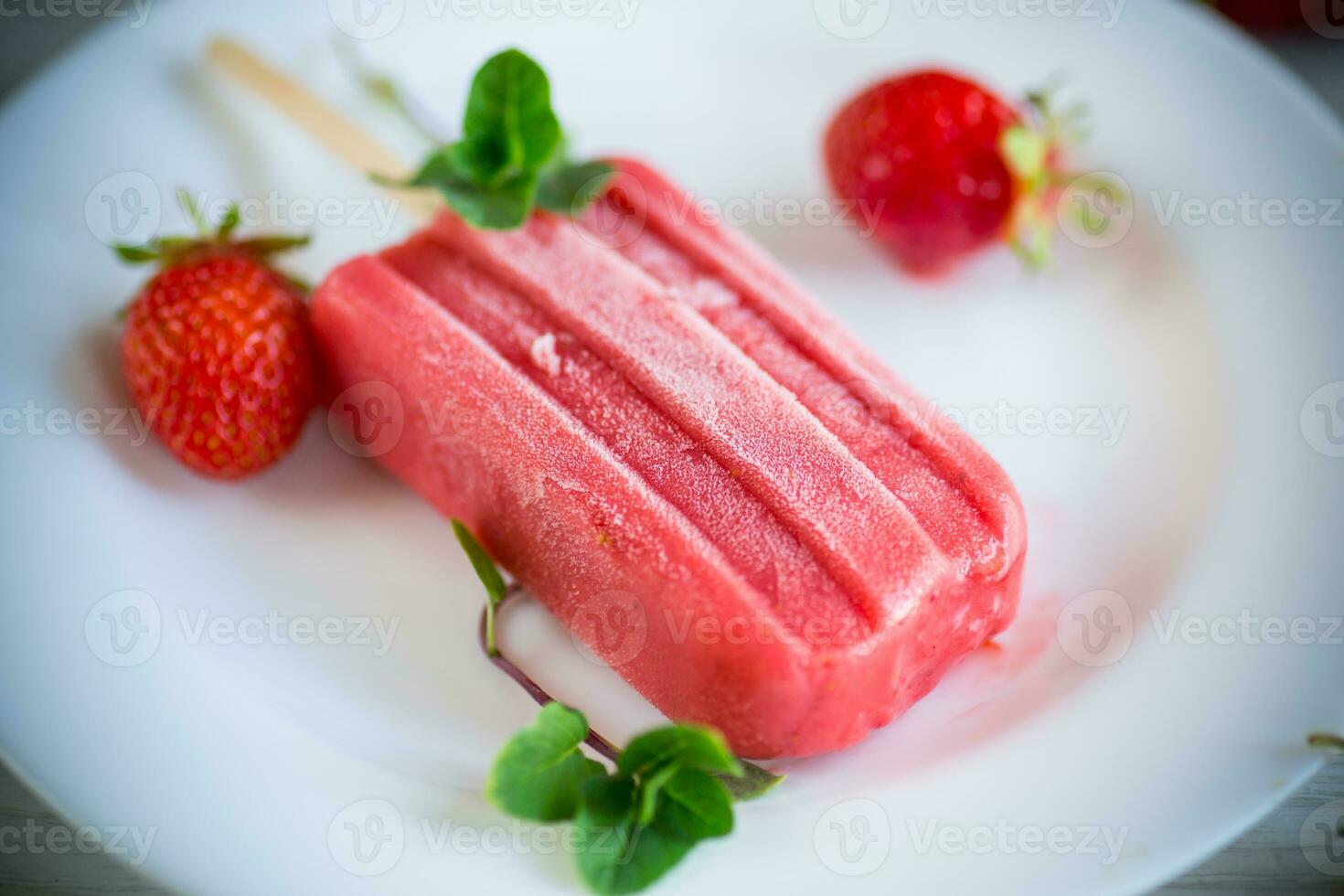 cooked homemade strawberry ice cream on a stick photo