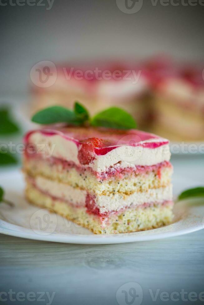 strawberry poppy cake with cream in a plate photo