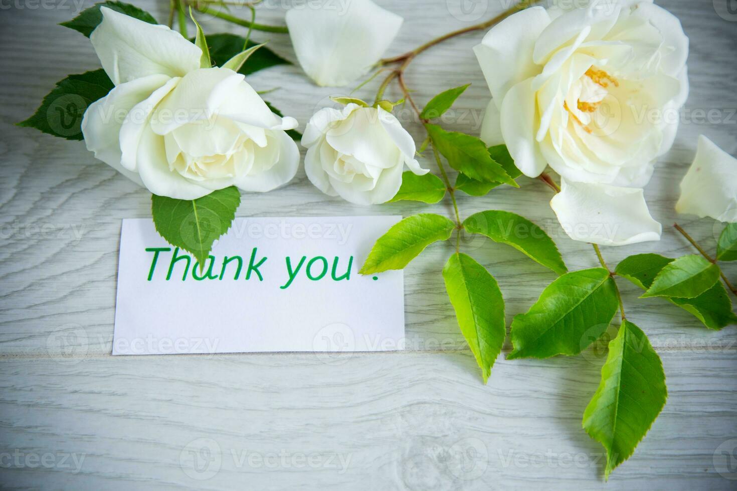 beautiful white summer roses, on a wooden table photo