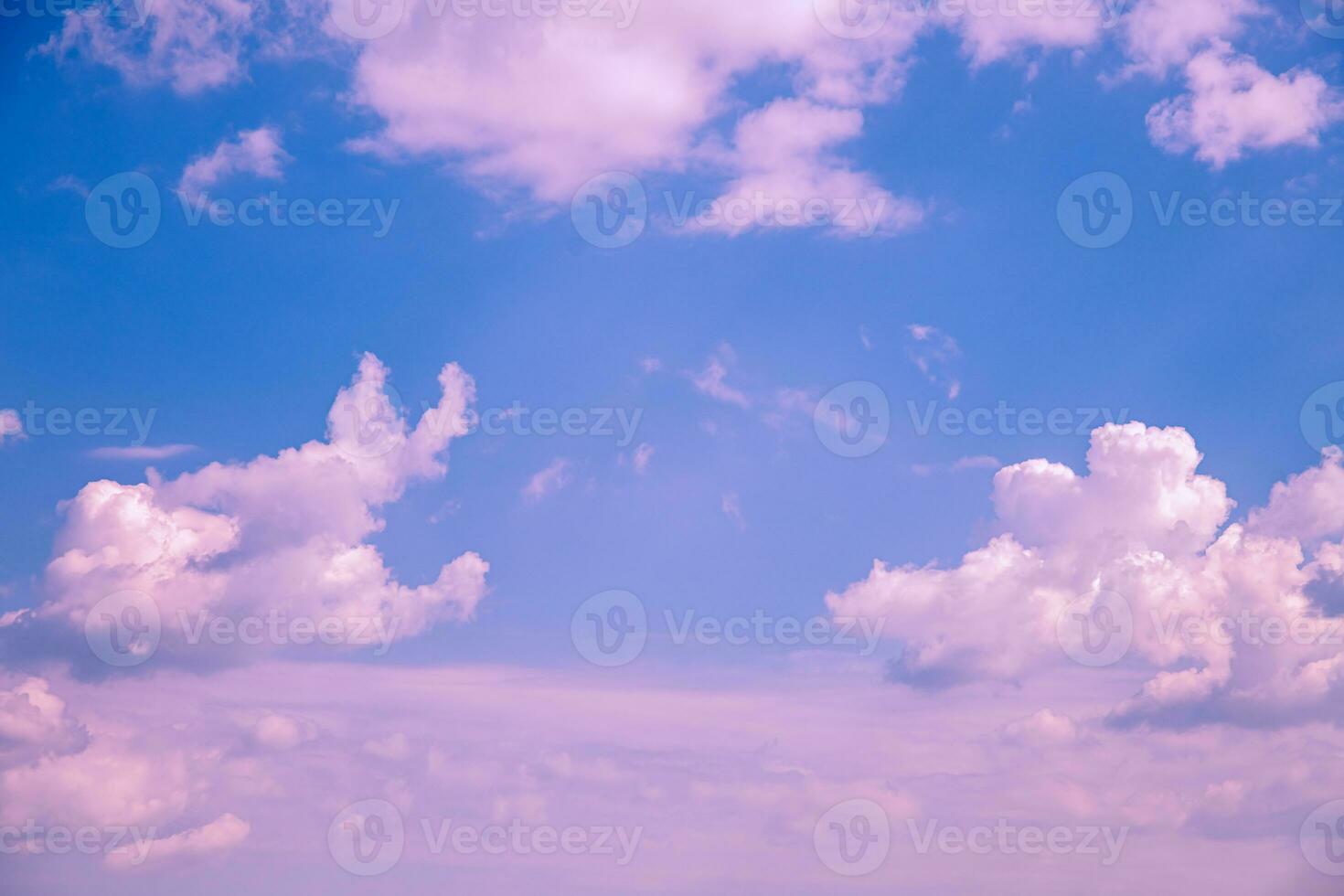 Beautiful cumulus pink clouds in the blue sky. natural background photo