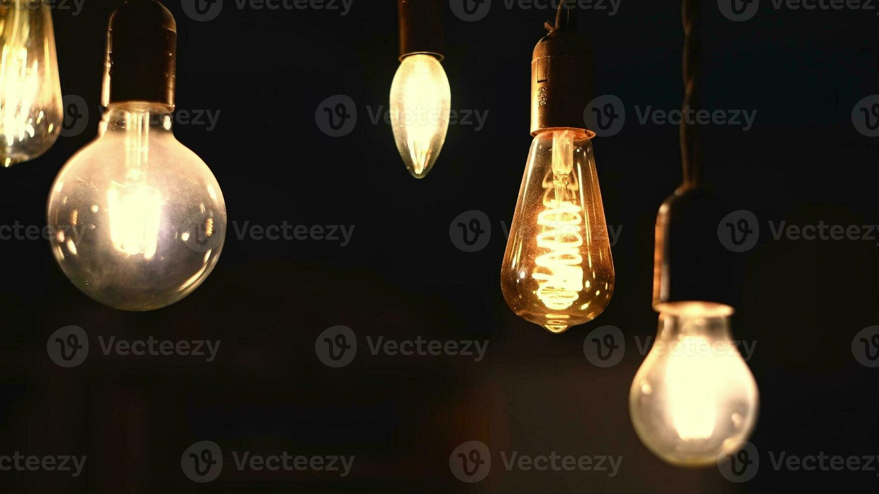 Retro light bulbs hanging on a dark background. Electricity, Vintage photo