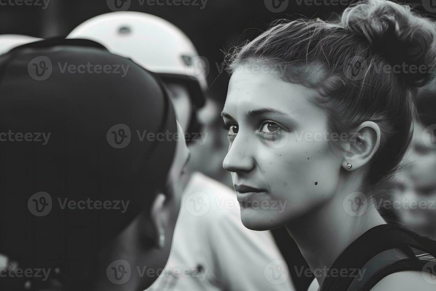 Female activist protesting with megaphone during a strike with group of demonstrator in background. Woman protesting in the city. Neural network AI generated photo