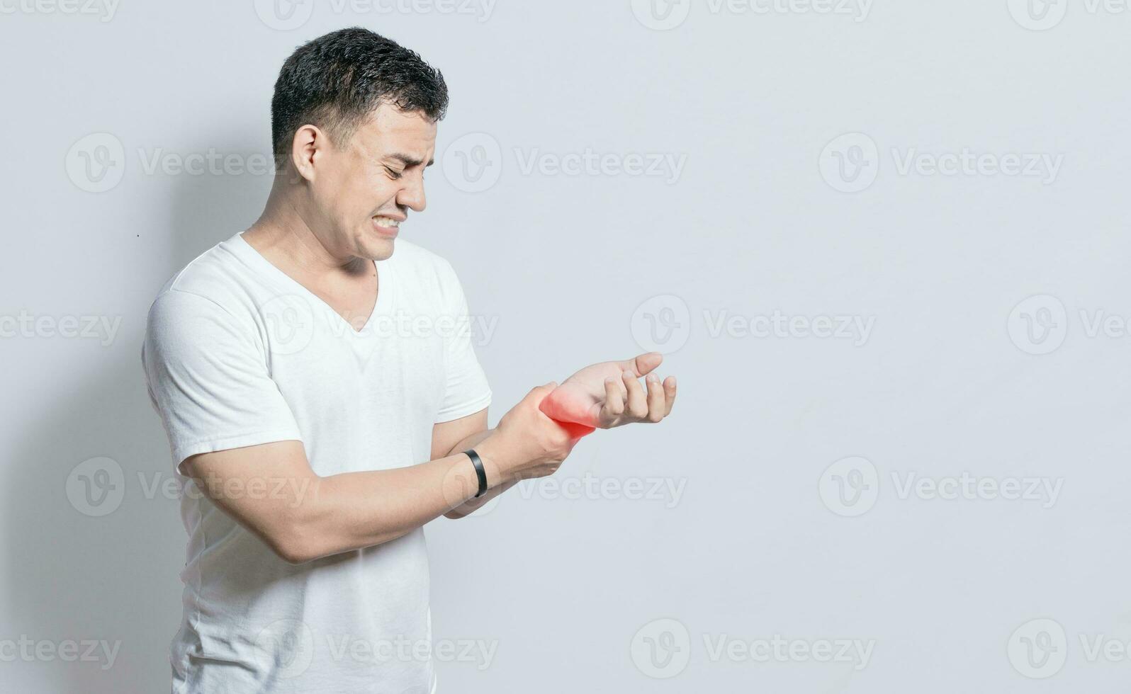 People with wrist pain isolated, concept of man with pain in the hands, man with arthritis rubbing, person with pain in the wrist, Concept of arthritis in the wrist photo