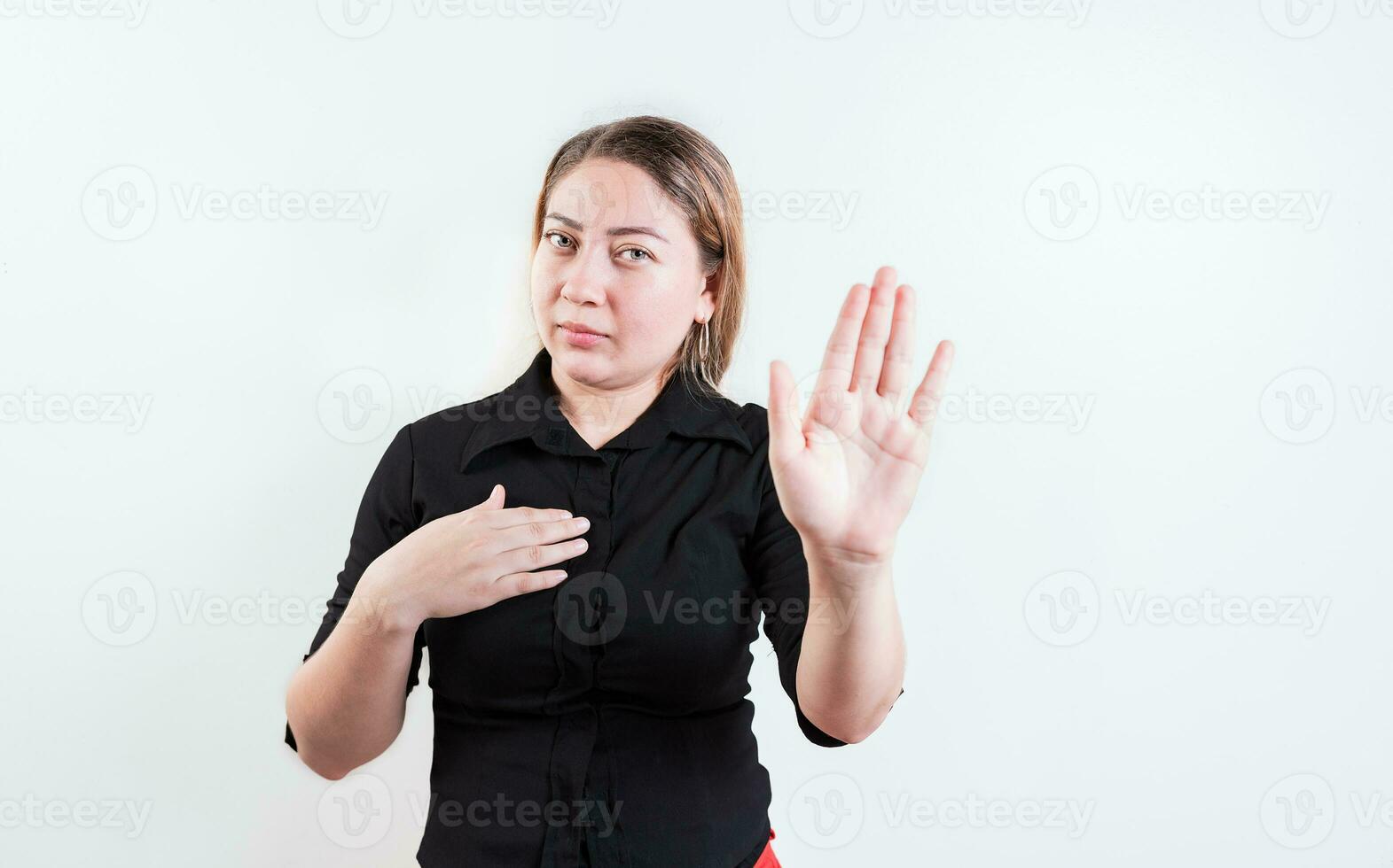 Young woman rejecting with the palm of hand isolated. People gesturing stop isolated. Latin girl gesturing stop with palm hand isolated photo