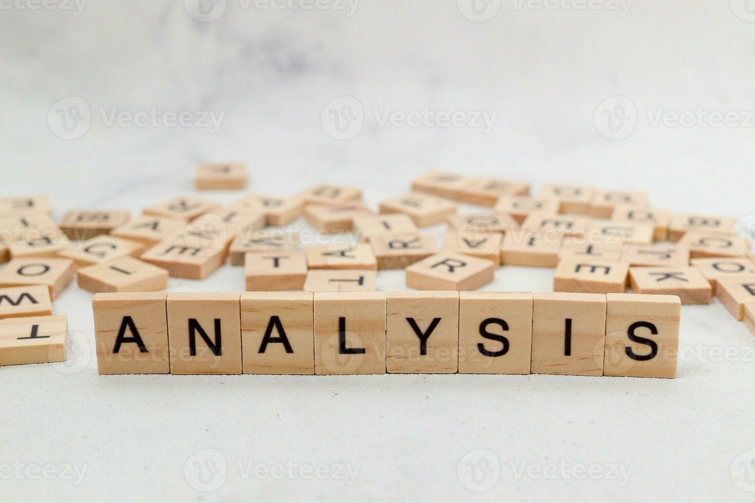 Top view of Analysis word on wooden cube letter block on white background. Business concept photo