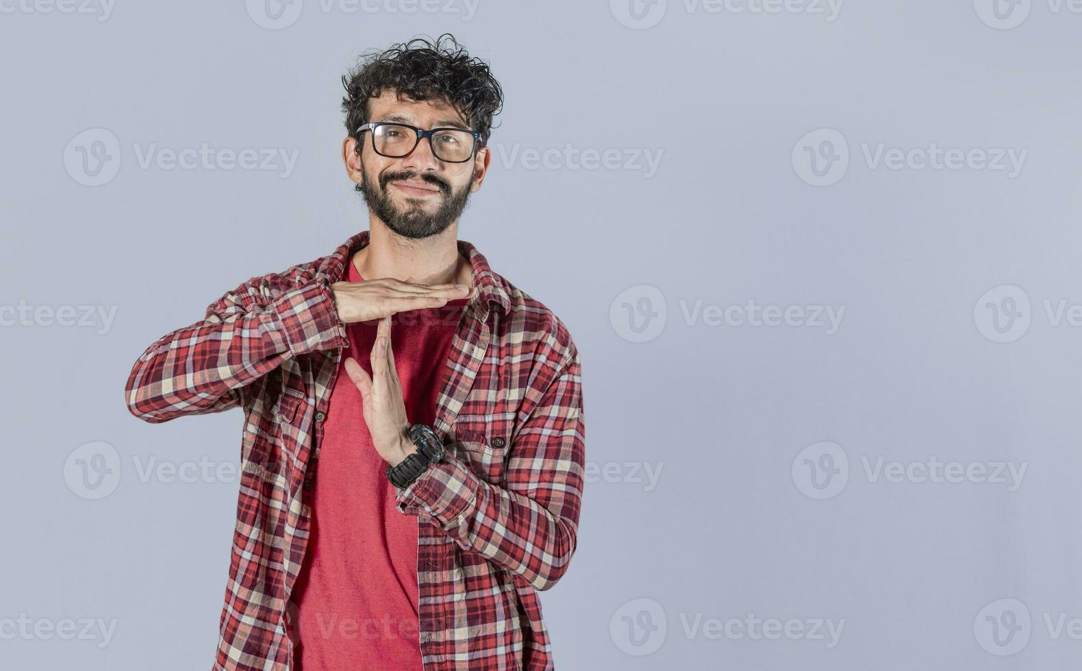 A man gesturing time out, Man doing time out gesture, latin guy doing time out gesture photo