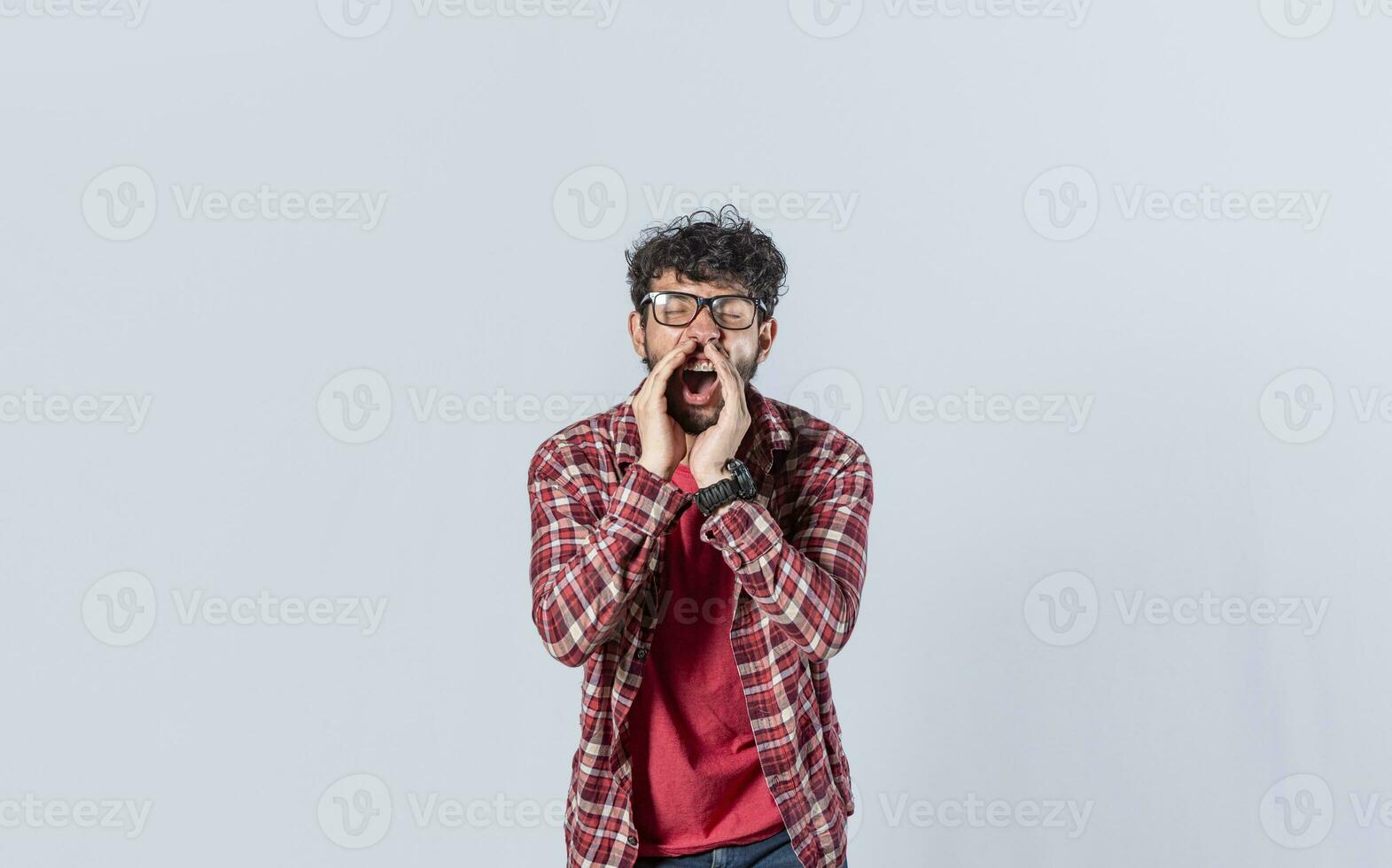Handsome man in glasses shouting an announcement, isolated. A person announcing and yelling, concept of a guy yelling an announcement photo