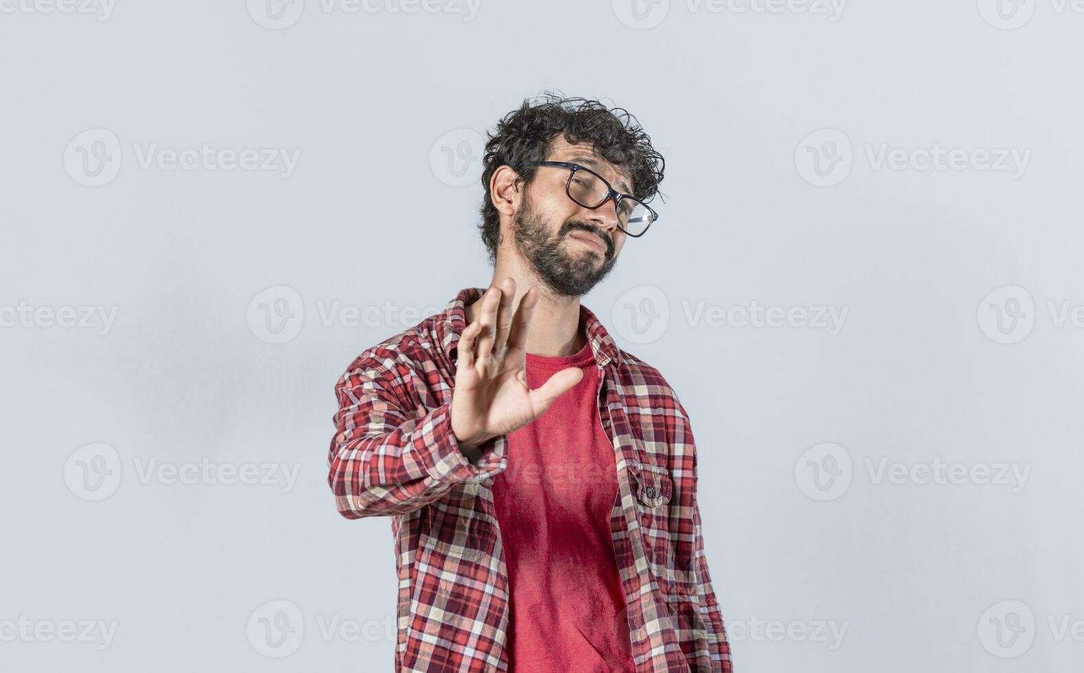 man rejecting with one hand, a man with rejection expression, isolated man with hand rejecting photo