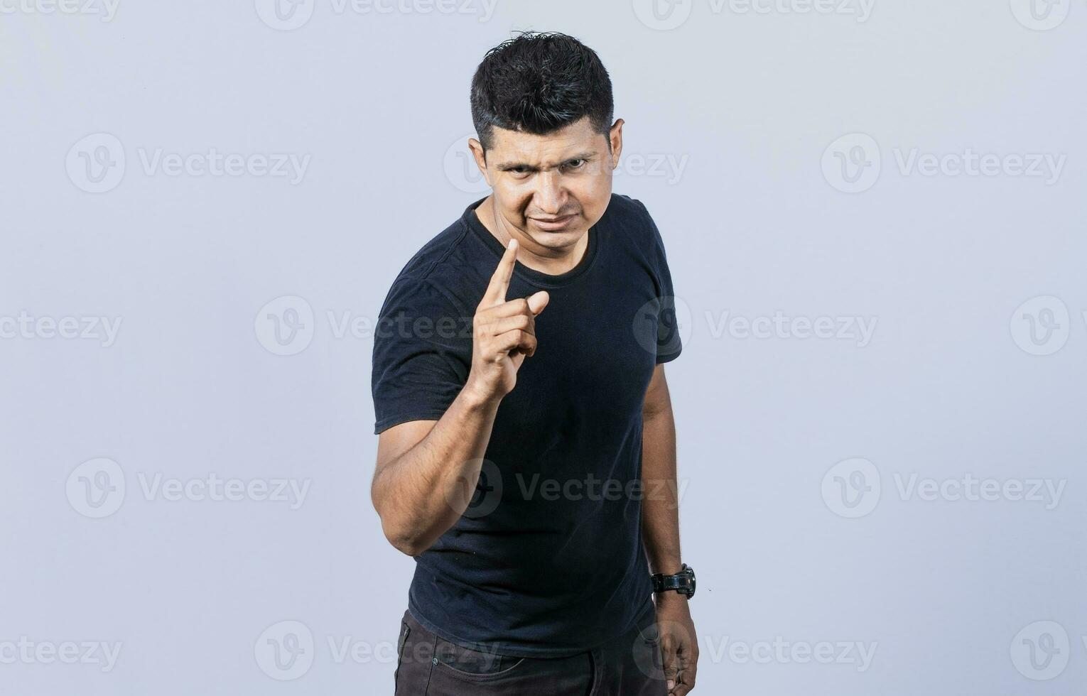 Concept of angry person threatening head on, Hey you, be careful. people looking angry and warning, angry man threatening finger at camera photo