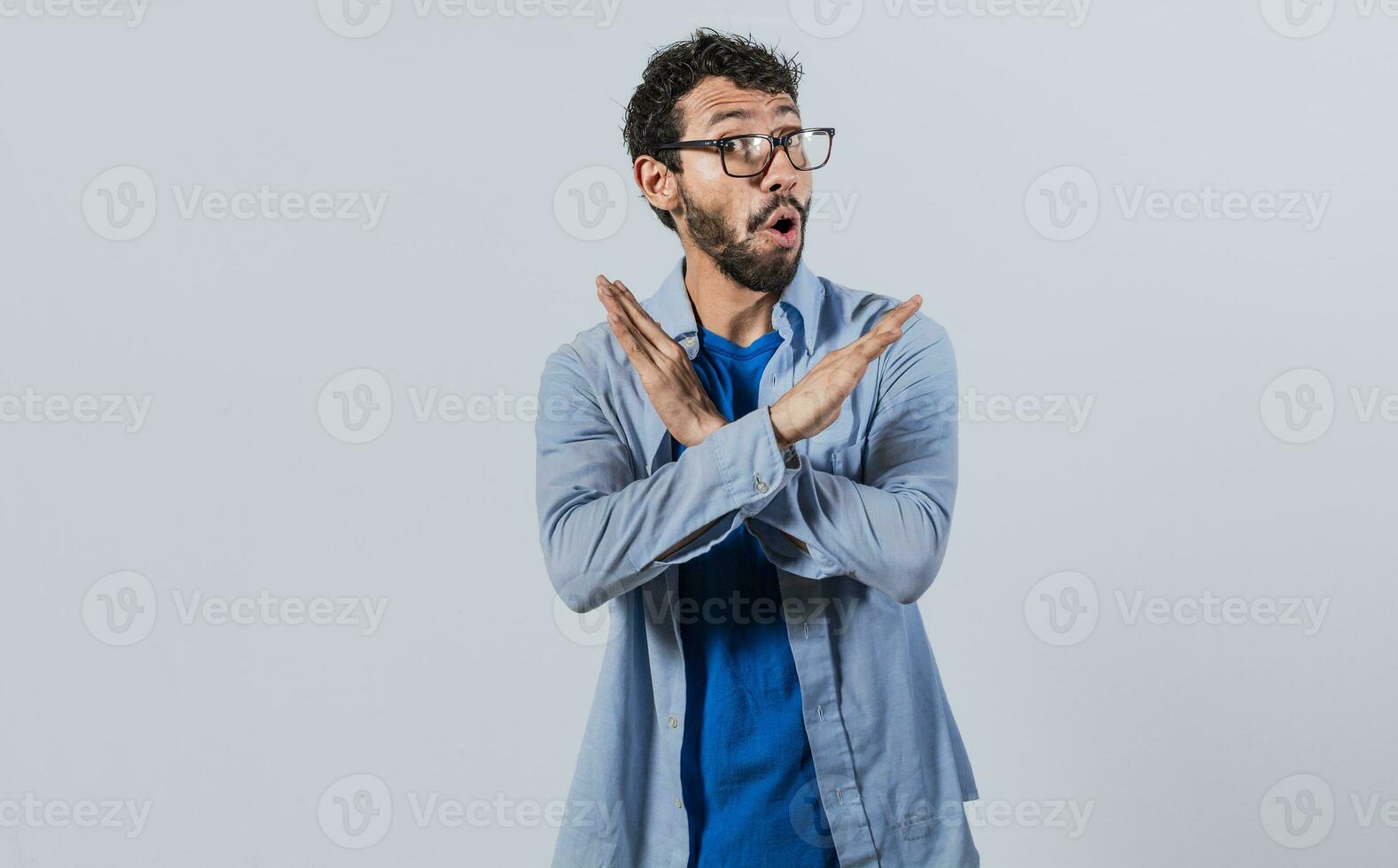 Man crossing arms in rejection, a man crossing his arms with rejection expression, concept of man rejecting photo