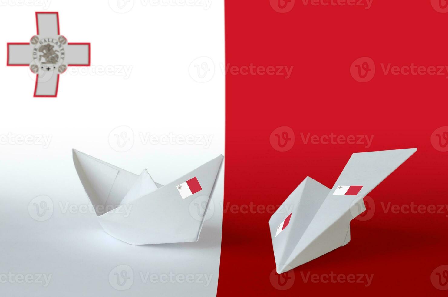Malta flag depicted on paper origami airplane and boat. Handmade arts concept photo