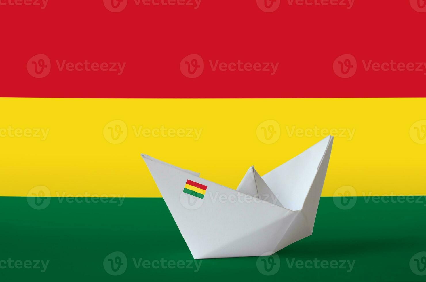 Bolivia flag depicted on paper origami ship closeup. Handmade arts concept photo